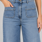 Jeans Aniye By a gamba ampia con tasche applicate - detail - immagine AI