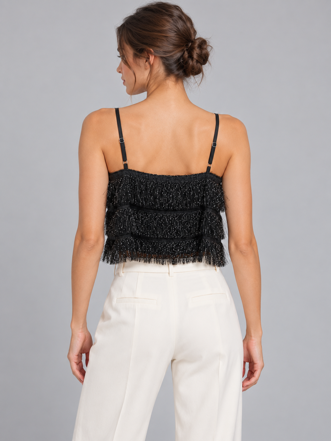 Top Dixie nero con frange su modella – retro