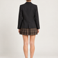 Tensione In – Tailleur con blazer nero e gonna a quadri - retro